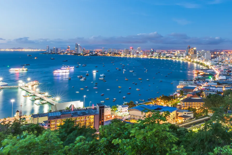 Pattaya Bay and its illuminated beachfront skyline at dusk